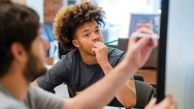 A male South student getting academic help in the Advising Center